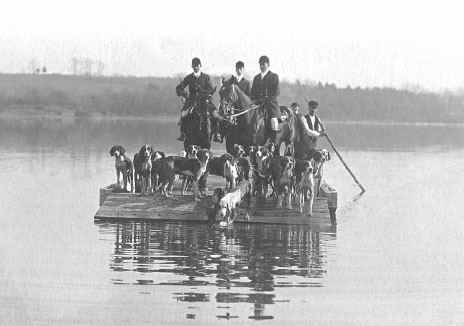 Vintage black and white photo of foxhunting group crossing the Potomac at White's Ferry