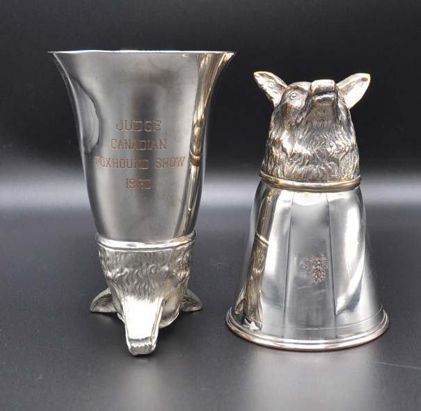 Vintage silver stirrup cups with foxhound head on display at the MHHNA