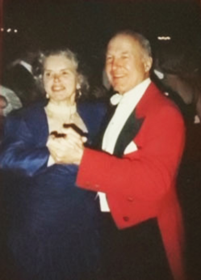 Peggy Haight dancing with her husband at a foxhunting event.