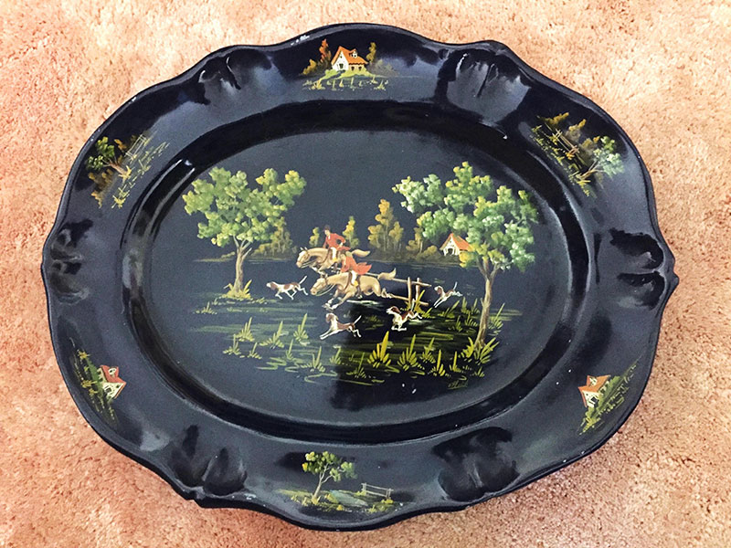 Ceramic platter painted black with a hand painted foxhunting scene by Diana Dickstein