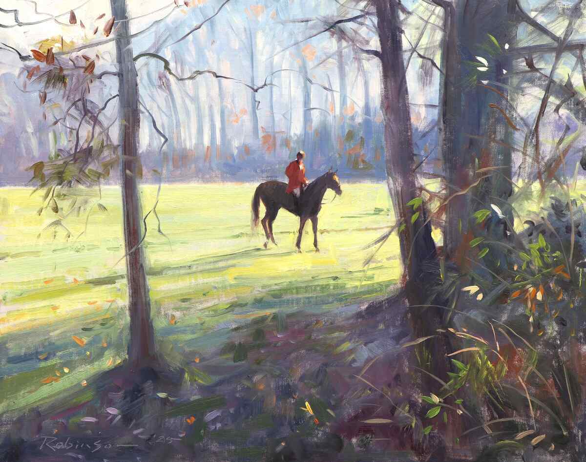 Huntsman on horse alone in meadow