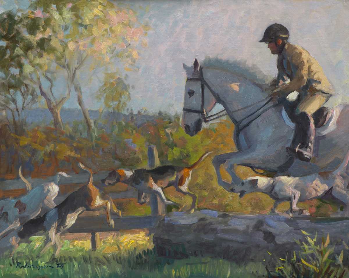 Hunt rider jumping log with hounds