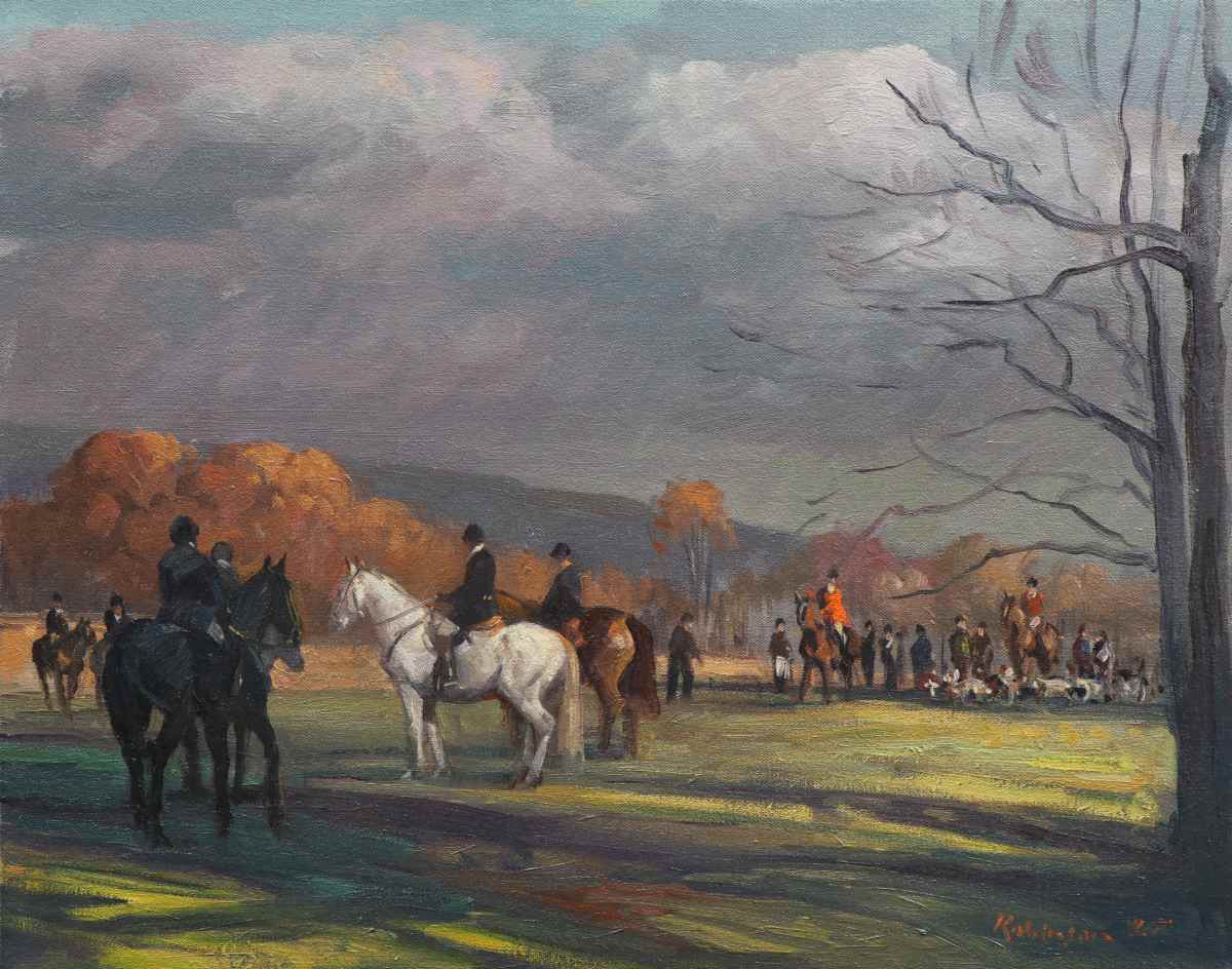 Hunt standing in pasture with trees showing fall color