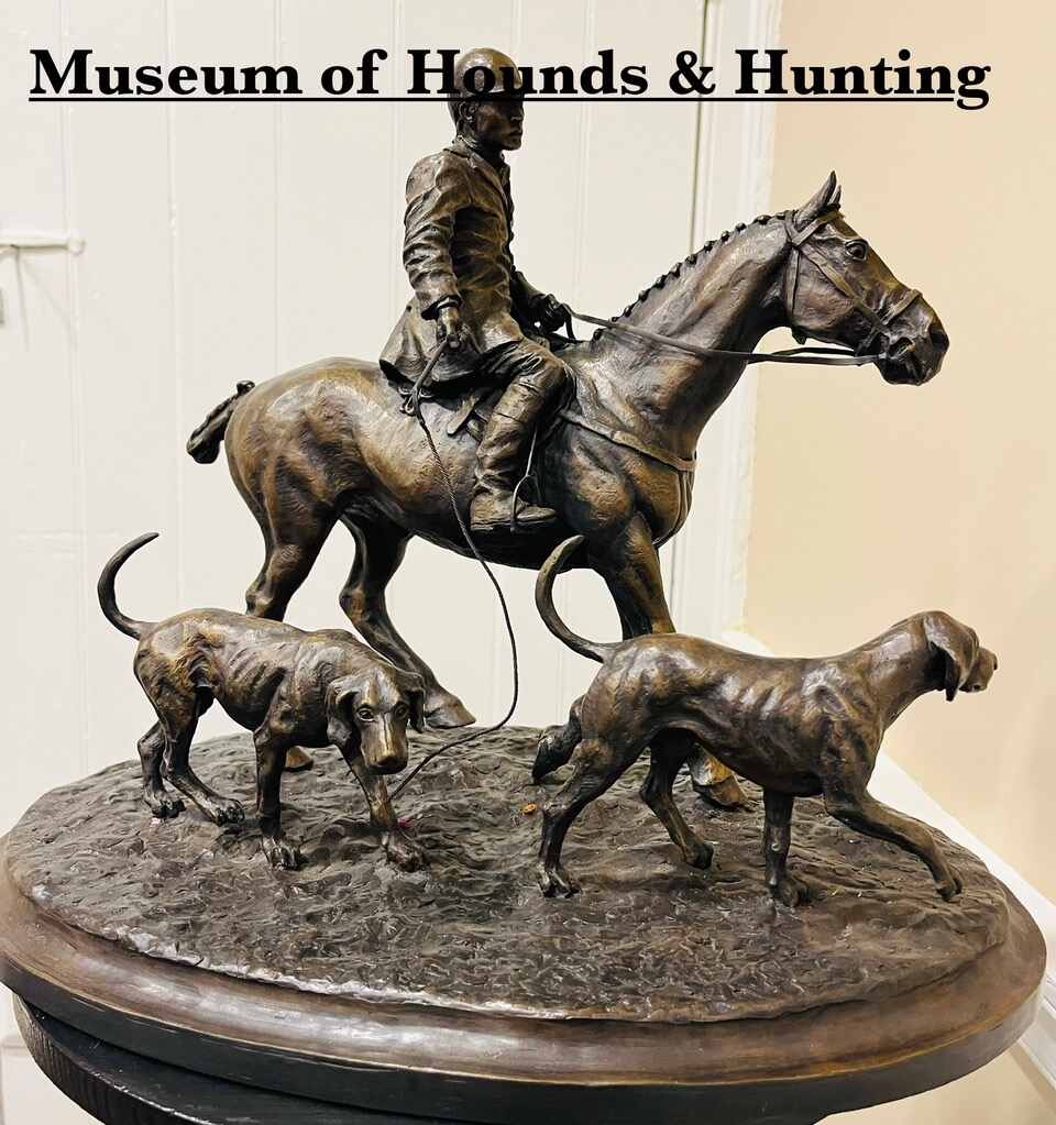 Bronze of horse with rider and two hounds