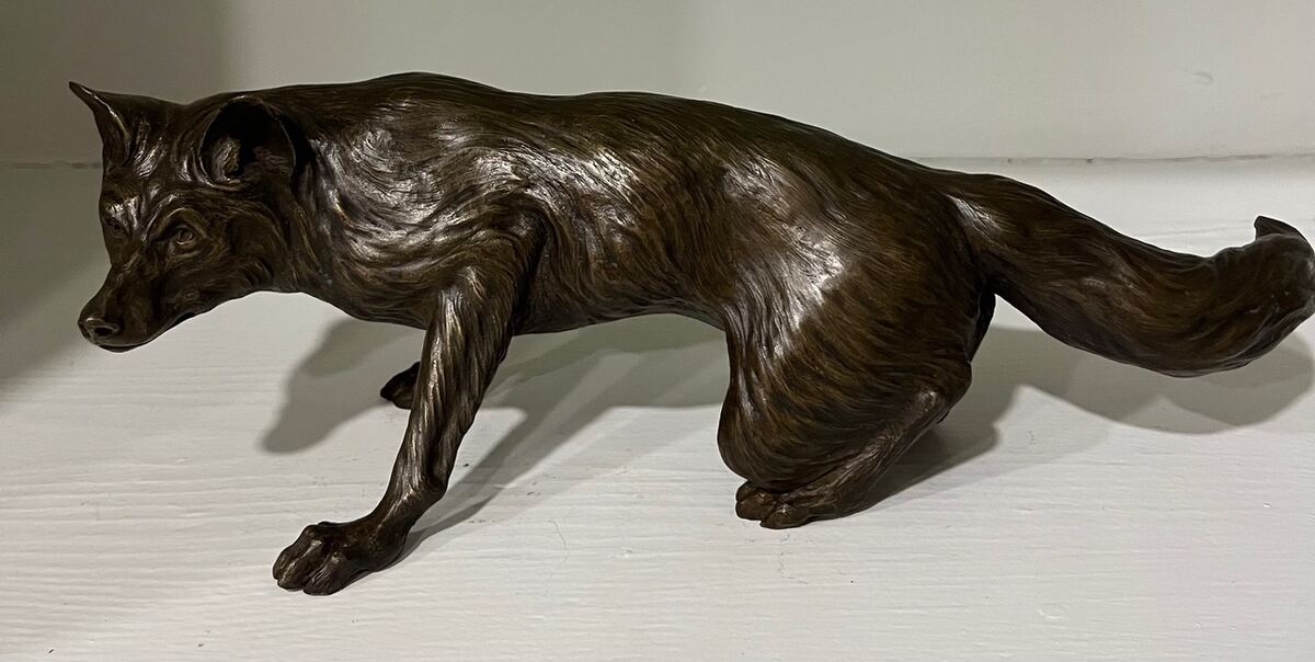 Bronze of fox crouching
