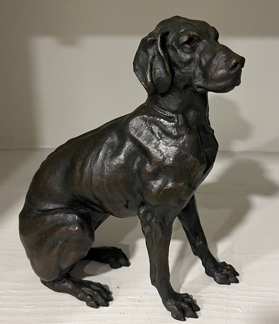 Bronze of hound sitting