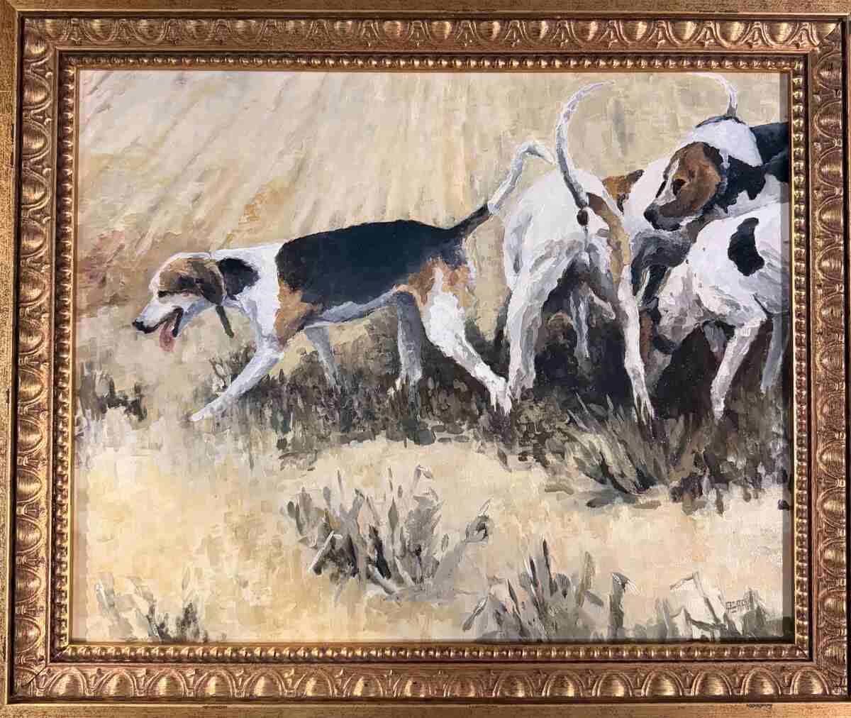 Several hounds in grass