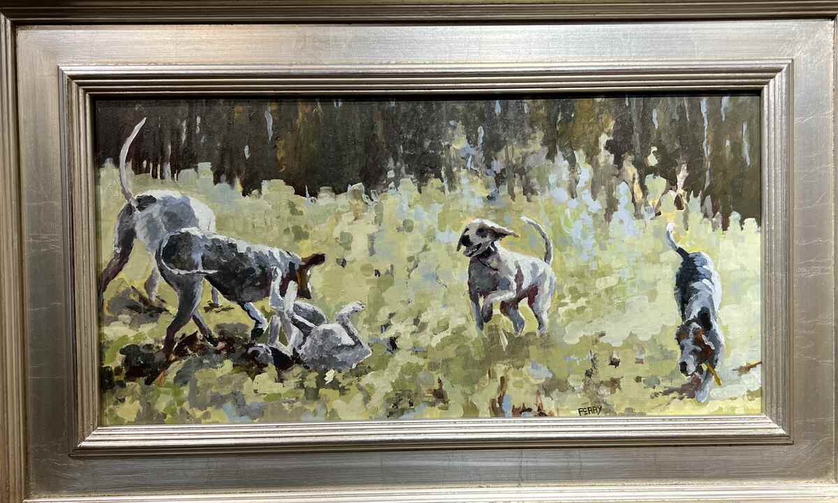 Framed painting of hounds playing in grass
