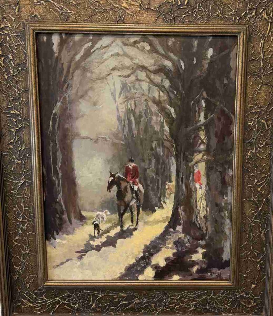 Hunt rider walking through trees with sunlight